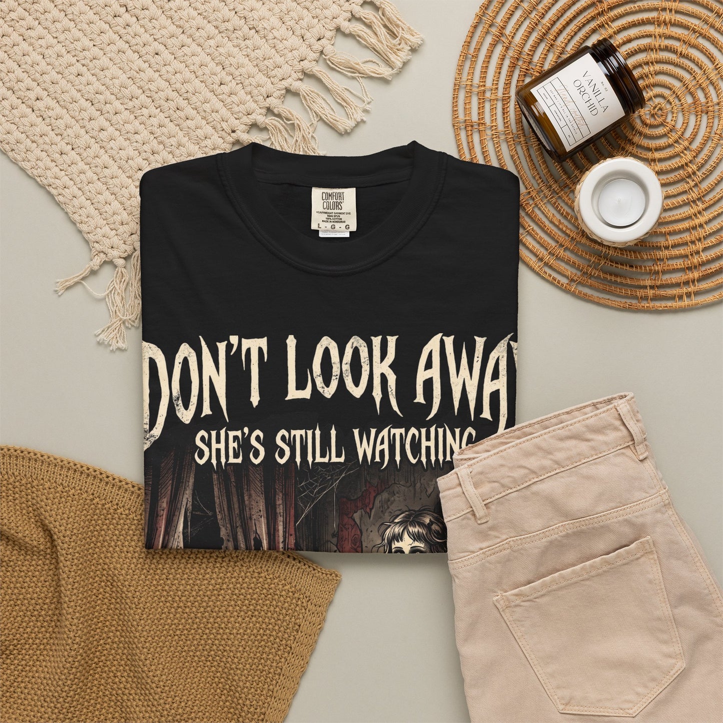 Horror Tee — "Don't Look Away, She's Still Watching" Creepy Doll Graphic T-Shirt