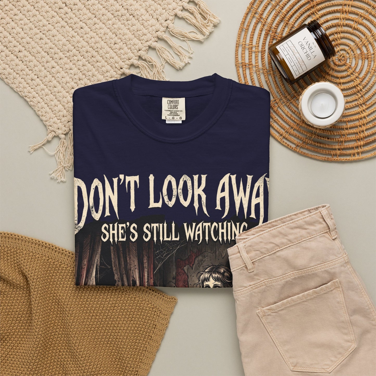Horror Tee — "Don't Look Away, She's Still Watching" Creepy Doll Graphic T-Shirt