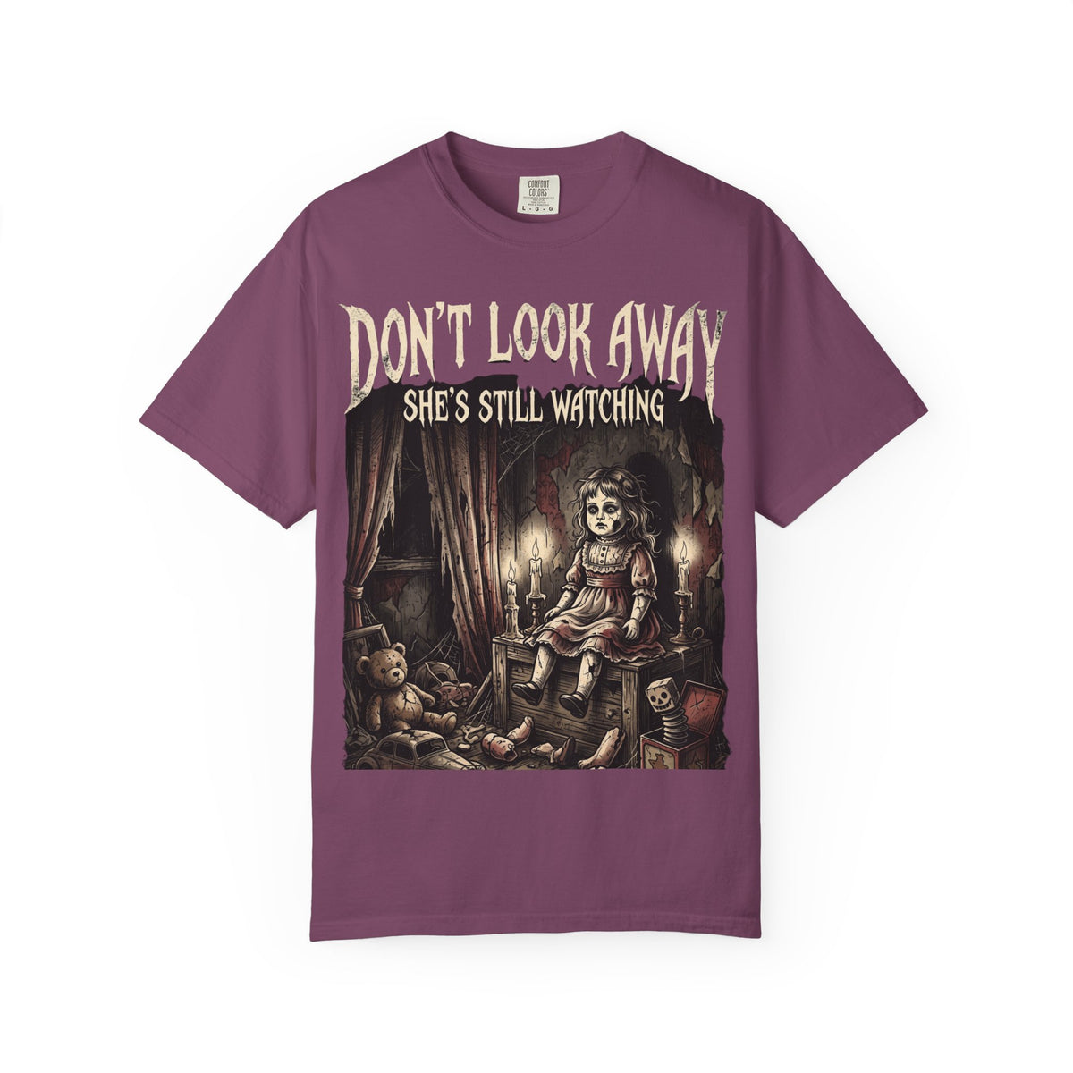 Horror Tee — "Don't Look Away, She's Still Watching" Creepy Doll Graphic T-Shirt