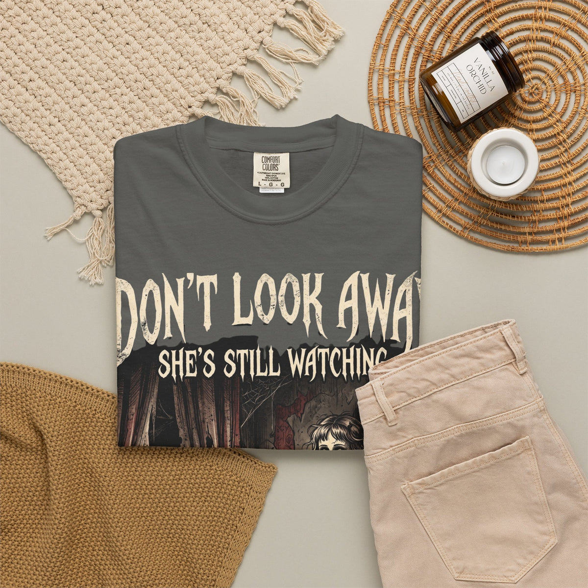 Horror Tee — "Don't Look Away, She's Still Watching" Creepy Doll Graphic T-Shirt