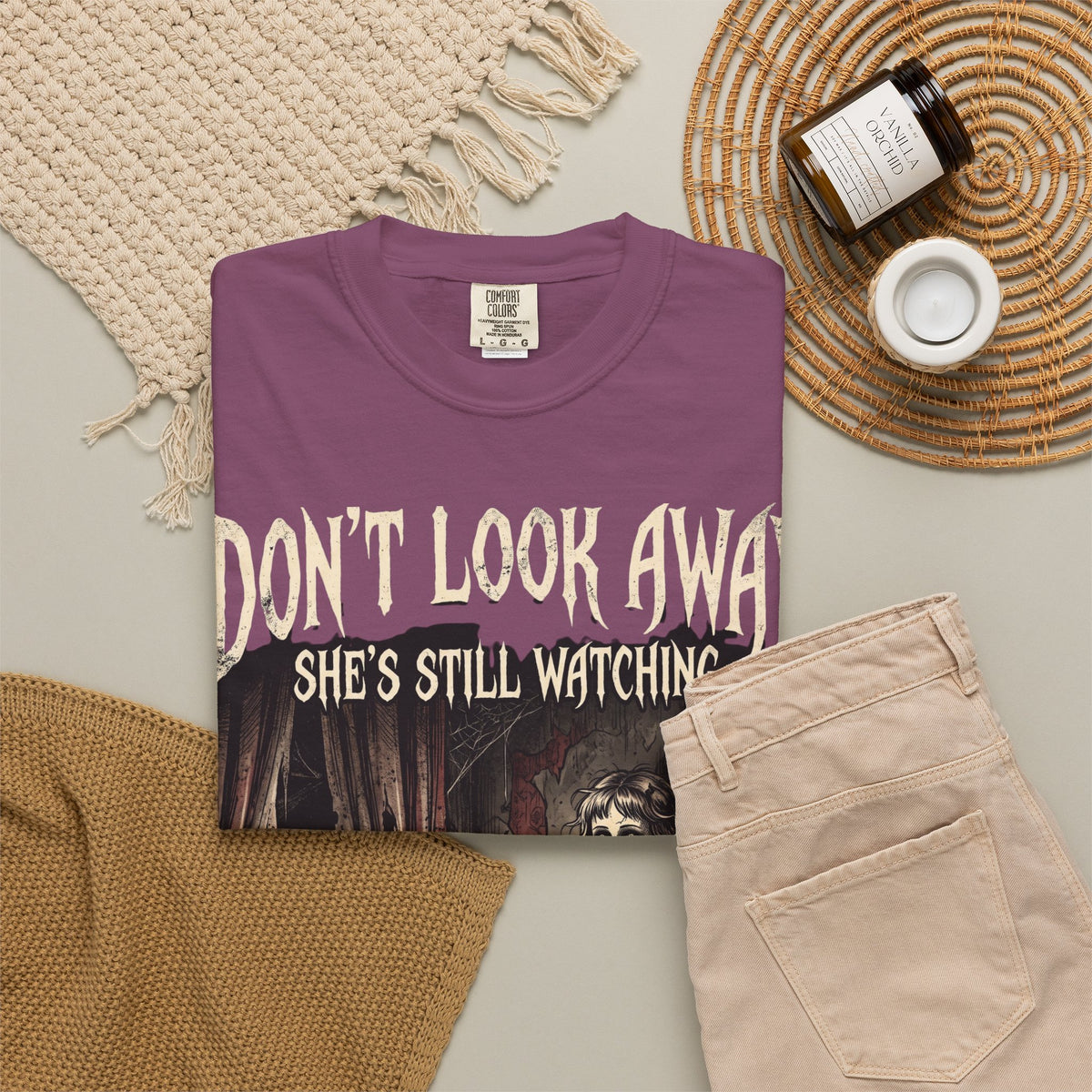 Horror Tee — "Don't Look Away, She's Still Watching" Creepy Doll Graphic T-Shirt