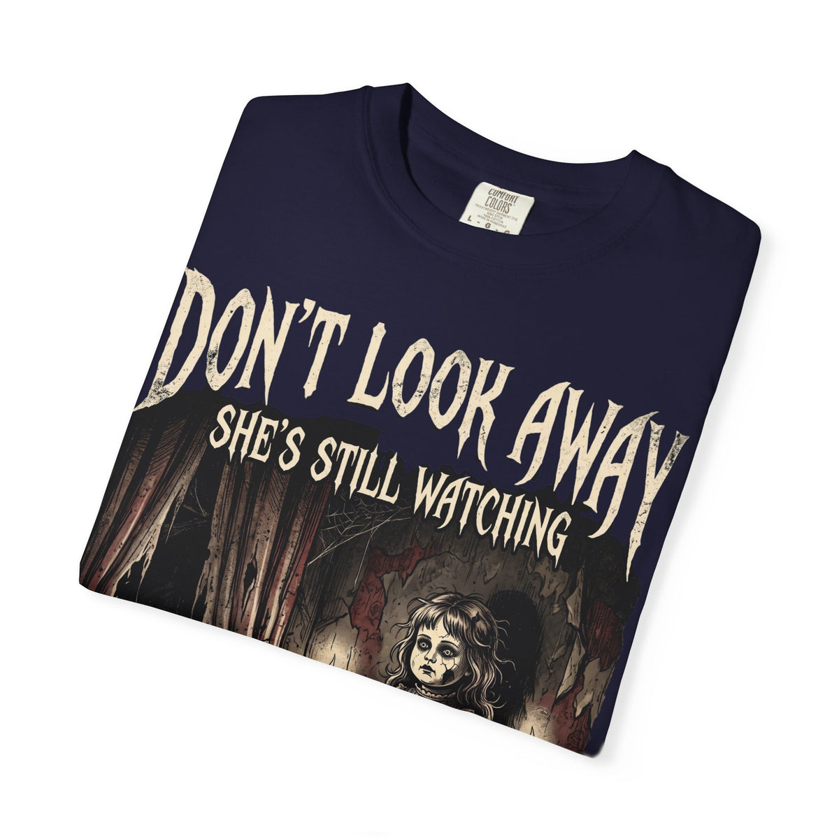 Horror Tee — "Don't Look Away, She's Still Watching" Creepy Doll Graphic T-Shirt